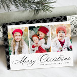 Elegant Black Script Merry Christmas 3 Photo Holiday Card<br><div class="desc">Simple Christmas card featuring three vertical photos with "Merry Christmas" displayed in a festive black calligraphy script. Personalise the front of the multi-photo Christmas card with your family name and the year. The card reverses to display a modern black and white plaid pattern.</div>