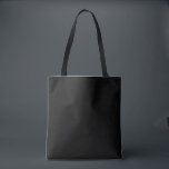 Elegant Black Tote Bag<br><div class="desc">This tote bag has a solid black background, it's designed as a foundational piece. It lets your wardrobe take centre stage. It's a neutral tone designed to harmonise with bold, earthy, or coastal palettes. It has no graphics or embellishments—intentionally blank to pair seamlessly with statement leggings, t-shirts, etc. Minimalist elegance...</div>