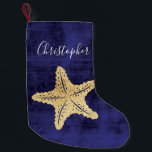 Elegant Blue Gold Beach Sea Star Monogrammed Small Christmas Stocking<br><div class="desc">Elegant gold coloured ocean sea star or starfish with monogrammed name. Blue background. Perfect for beach cottage theme or nautical Christmas.</div>