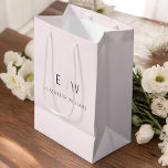 Elegant Blush Pink Minimalist Monogram Name Medium Gift Bag<br><div class="desc">Present your gifts in style with our Blush Pink Modern Minimalist Monogram Name Gift Bag. This elegant bag boasts a clean and contemporary design, featuring a customisable monogram that adds a personalised touch to your gift-giving. Crafted with quality in mind, this bag is both sophisticated and minimalist, making it suitable...</div>