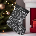 Elegant Botanical Pine And Berries Personalised Small Christmas Stocking<br><div class="desc">This elegant, personalised Christmas stocking features a charming botanical design with pine and berries, rendered in a stylish black and white colour scheme. The intricate pattern showcases various leaves, pine branches, and clusters of berries, creating a festive yet sophisticated look. The customisable area at the top allows you to add...</div>