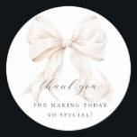 Elegant Bow Bridal Shower Gift Classic Round Sticker<br><div class="desc">"She's tying the knot" theme bridal shower favour bag with an elegant white bow design. Perfect for gift tag or envelope seal as well</div>