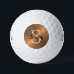 Elegant Bronze Metallic Monogram Name Mens Golf Balls<br><div class="desc">Play your golfing game in style with these Elegant Bronze Metallic Monogram Name Mens Golf Balls. CLICK PERSONALIZE TEMPLATE OPTION AND ENTER NAME AND MONOGRAM INITIAL. Designed with masculine faux metallic bronze background and light tan brown monogram on the centre. Personalised with name in black calligraphy script lettering. Makes a...</div>