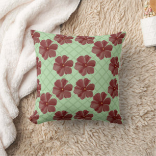 Elegant burgundy flowers on sage green cushion