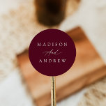 Elegant Calligraphy Burgundy Wedding Classic Round Sticker<br><div class="desc">Simple,  calligraphy wedding stickers featuring your names in white lettering with a burgundy background. The burgundy wedding stickers are perfect to use for envelope seals,  wedding favours,  and more! The elegant wedding stickers were designed to coordinate with our Elegant Calligraphy Burgundy wedding collection.</div>