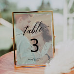 Elegant Calligraphy | Faded Photo Table Number<br><div class="desc">This elegant calligraphy faded photo table number card is perfect for a simple wedding. The neutral design features romantic and whimsical typography with two of your photos, one on the front and one on the back. The card prints on the front and back (double-sided). Add each table number that you...</div>