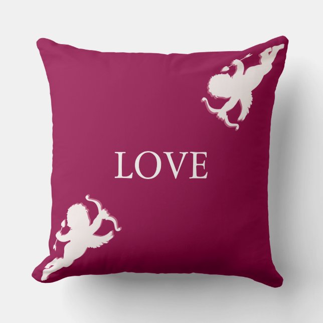 Elegant cupids in white on burgundy cushion (Front)