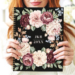 Elegant Dark Floral Wreath Custom Monogram Planner<br><div class="desc">This sophisticated design features a lush floral wreath with rich blooms in shades of burgundy, blush, and cream, accented by soft greenery and berries. The dark black background enhances the timeless elegance of the floral arrangement, while the customisable initials and year make it unique and personal. Perfect for professionals, students,...</div>