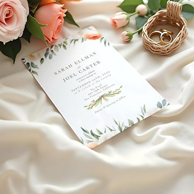 Elegant Ethereal Botanical Wedding Invitation (A peach toned wedding invitation mockup with floral details resting on a creamy fabric beside roses)