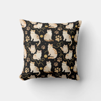 Elegant felines and sparkling gold yarn on black,  cushion