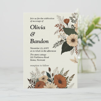 Elegant floral accents and a soft colour palette invitation