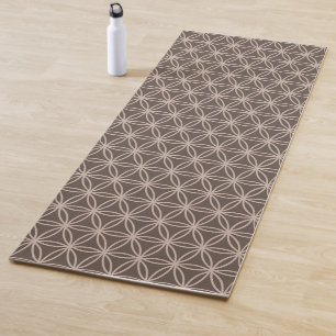 Elegant flower of life on brown background yoga mat