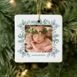 Elegant Foliage Frame First Christmas Teal Photo Ceramic Ornament<br><div class="desc">This darling first Christmas ornament features a pretty foliage and pine frame in teal blue green, surrounding your photo. There's a text template for baby's name on the front, as well as more text templates on the back for further personalization. Create a precious keepsake to treasure for years to come!...</div>