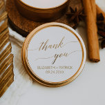 Elegant Gold Calligraphy Thank You Wedding Favour Classic Round Sticker<br><div class="desc">These elegant gold calligraphy thank you wedding favour stickers are perfect for a simple wedding. The neutral design features a minimalist sticker decorated with romantic and whimsical faux gold foil typography. Personalise the sticker labels with your names, the event (if applicable), and the date. These stickers can be used for...</div>