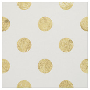 white fabric with gold polka dots