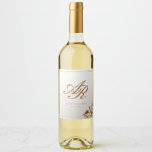Elegant Gold Monogram Wine Bottle Label<br><div class="desc">Add a refined finishing touch to your celebration with these elegant wedding wine labels. Featuring a timeless ivory background, delicate gold botanical accents, and a classic monogram centerpiece, this design brings sophistication and cohesion to your wedding décor. Perfect for reception tables, wedding favors, rehearsal dinners, or anniversary keepsakes, these labels...</div>