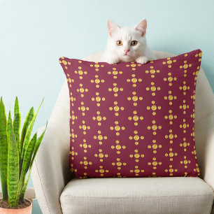 Elegant golden dots on burgundy red cushion