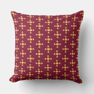 Elegant golden dots on burgundy red cushion