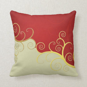 Elegant golden swirls on red and cream cushion