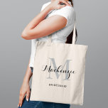 Elegant Gray Black Monogram Bridesmaid Tote Bag<br><div class="desc">Understated and refined,  this elegant tote features a gray monogram initial with a personalized name in classic black script and the bridal party role beneath. A sophisticated neutral monogram design that coordinates seamlessly with any wedding color palette. Name,  initial,  and role are fully customizable.</div>