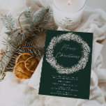 Elegant Green White Floral Wreath Christmas Party Invitation<br><div class="desc">Elegant Green and White Floral Wreath Christmas Party Invitation Invite your friends and family to your annual Christmas party with this elegant and sophisticated invitation. Set against a deep green background, the design features a beautiful white floral wreath encircling the words "Merry Christmas." Details of the event are clearly laid...</div>