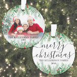 Elegant Greenery Family Photo Merry Christmas Ornament<br><div class="desc">Personalised Name Elegant Greenery Merry Christmas Script Family Photo Custom Ornament Dated. Create a personalised holiday keepsake with this elegant Christmas ornament, featuring a large family photo framed by lush botanical greenery. The top of the design showcases a seamless white gradient that blends into pine branches, evergreen leaves, and red...</div>