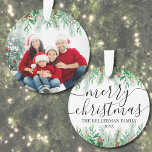 Elegant Greenery Merry Christmas Family Photo Ornament<br><div class="desc">Personalised Name Elegant Greenery Merry Christmas Script Family Photo Custom Ornament Dated. Create a personalised holiday keepsake with this elegant Christmas ornament, featuring a large family photo framed by lush botanical greenery. The top showcases a seamless white gradient that blends into pine branches, evergreen leaves, and red holly berries, offering...</div>