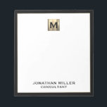 Elegant Luxury Monogram Notepad<br><div class="desc">Elevate your stationery game with this monogrammed notepad featuring classic block typography and a black frame with a brushed gold medallion monogram. The notepad includes space for custom text, such as your name and title, making it perfect for personal or professional use. Use it to jot down notes, ideas, and...</div>