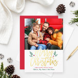 Elegant Merry Christmas Gold Brushed Script Photo Foil Holiday Card<br><div class="desc">Holiday photo card features modern gold foil "Merry Christmas" brushed calligraphy script text with green and red holly berry design accents. Personalize the "and happy new year" greeting and family member names with your custom wording. An optional bonus square photo dresses up the back of the card. Customize the festive...</div>