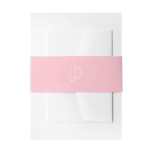 Elegant minimalist modern initial on pastel pink invitation belly band