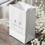 Elegant Modern Modern Minimalist Monogram Name Medium Gift Bag<br><div class="desc">Present your gifts in style with our Black and White Modern Minimalist Monogram Name Gift Bag. This elegant bag boasts a clean and contemporary design, featuring a customisable monogram that adds a personalised touch to your gift-giving. Crafted with quality in mind, this bag is both sophisticated and minimalist, making it...</div>