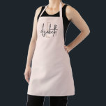 Elegant Monogram Blush Pink Modern  Apron<br><div class="desc">Make a stylish statement with this stunning monogram name pink, black and gold modern apron. Printed with your own name in a unique black script font with a gold initial, this apron offers a unique look that will make you look great while keeping your clothes protected. Whether you are a...</div>