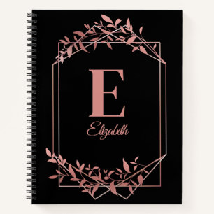 Elegant monogrammed rose gold frame leaves black notebook