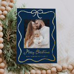 Elegant Navy and Gold Ribbon Bow 2 Photo Foil Holiday Card<br><div class="desc">Celebrate the season with our Elegant Navy and Gold Foil Ribbon Bow 2 Photo Holiday Card. This charming design showcases your cherished family photo surrounded by a festive gold foil ribbon frame, complete with a bow at the top. The navy background beautifully highlights the handwritten "Merry Christmas" greeting in gold...</div>