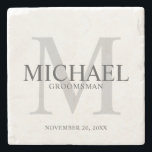 Elegant Personalised Groomsmen Stone Coaster<br><div class="desc">Add a personal touch to your wedding with personalised groomsmen stone coaster.
This coaster features personalised groomsman's name with title and wedding date in grey and monogram in light grey as background,  in classic serif font style.

Also perfect for best man,  father of the bride,  ring bearer and more.</div>