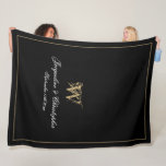Elegant Personalised Newlywed Keepsake Monogram Fleece Blanket<br><div class="desc">Elegant Chic Black Personalised Newlywed Keepsake Monogram Fleece Blanket. Personalised black and gold monogrammed Fleece Blanket. Classic romantic script for the initial, the names of the bride and groom, and the wedding date on a simple elegant black background. A perfect gift idea for a wedding gift, a newly weds gift,...</div>