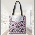 Elegant Pink and Black Rose Monogram Name Tote Bag<br><div class="desc">Unveil a touch of personalised elegance with this enchanting tote bag. Featuring a delicate blush pink background adorned with a classic black rose pattern. Personalise with your chosen name and monogrammed letter, making this bag a truly thoughtful and unique gift for birthdays, anniversaries, or bridal party. It's the perfect blend...</div>