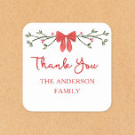 Elegant Red Bow Personalised Christmas Thank You Square Sticker<br><div class="desc">Add a touch of holiday cheer to your gratitude with this elegant Christmas thank-you stickers. Featuring a festive red bow and delicate greenery design, these customisable stickers is perfect for expressing heartfelt thanks during the holiday season. The classic design pairs beautifully with any holiday theme, making it perfect for spreading...</div>