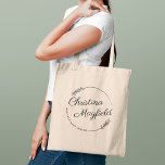 Elegant Round Leaves Personalised Name Business Tote Bag<br><div class="desc">Stylish business tote bag features a custom design for a small business owner with first and last name in modern calligraphy script framed by a round wreath with rustic chic laurel leaves. Personalise the curved text with a business name or other preferred wording.</div>
