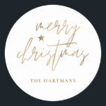 Elegant Script Merry Christmas Gold Star White Classic Round Sticker<br><div class="desc">These stylish Christmas holiday stickers feature elegant typography reading,  "Merry Christmas" in faux gold foil,  along with a little star accent. The background colour can be customised to any colour you'd like! Great for use as envelope seals,  party favour labels,  or gift sticker labels!</div>