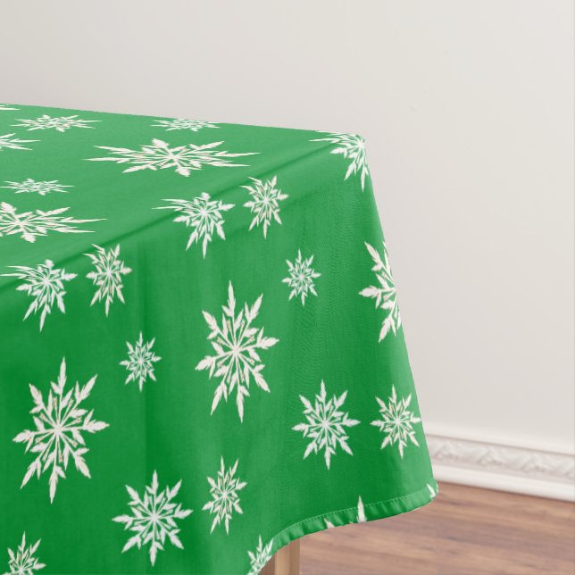 Elegant snowflakes on green tablecloth (In Situ)