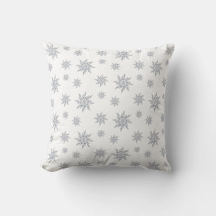 Elegant snowflakes on white cushion