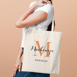 Elegant Terracotta Custom Wedding Bridesmaid Name Tote Bag<br><div class="desc">Elegant custom wedding tote bag features a personalised monogram typography design with modern calligraphy script name and serif monogram initial in terracotta dark orange and black colours. Includes custom text for a bridal party title like "BRIDESMAID" or other preferred wording.</div>