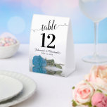 Elegant Turquoise Blue Rose Wedding Table Number<br><div class="desc">These tent signs will not only help your guests find their tables, they'll also make your wedding reception more beautiful. The design is both elegant and romantic featuring a single sky blue, turquoise, or azure coloured rose lying on its side reflecting in water with waves and ripples. The title is...</div>