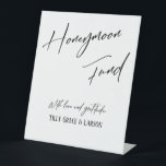 Elegant Typography Simple Honeymoon Fund White Pedestal Sign<br><div class="desc">This collection features an elegant, modern, handwritten font to create key words and phrases. In this piece, the graphic typography overlays read "Honeymoon Fund" in the large header area and "With love & gratitude, " near the bottom. Use the template fields to add your names. Feel free to change the...</div>
