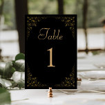 Elegant Vintage Foliage Black Gold Wedding Table Number<br><div class="desc">This elegant vintage-inspired wedding table number card features a delicate gold botanical foliage border on a black background. The word "table" appears in gold-coloured script,  with the editable table number below in gold serif font.</div>