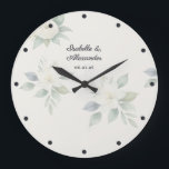 Elegant Watercolor Floral Wedding Personalised Large Clock<br><div class="desc">Add a touch of timeless romance to your home with this elegant, personalised wall clock. Featuring delicate white flowers and green leaves in a watercolor style, this botanical design perfectly captures the popular soft cottagecore and modern romantic aesthetics. The soft florals are beautifully anchored by deep blue typography and matching...</div>