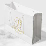 Elegant White and Gold Personalised Bridesmaid Large Gift Bag<br><div class="desc">Elegant Personalised Bridesmaid Gifts featuring personalised monogram in gold elegant script font style with bridesmaid's name and title in gold classic serif font style. Also perfect for Maid of Honour, Flower Girl, Mother of the Bride and more. Please Note: The foil details are simulated in the artwork. No actual foil...</div>