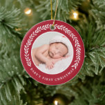 Elegant Wreath Baby's First Christmas | Photo Ceramic Tree Decoration<br><div class="desc">Create a special keepsake for baby's very first Christmas with this stylish photo ornament!  It features a pretty laurel wreath in white surrounding the circle shaped photo template. Text templates are included on the back for baby's name and the year.</div>