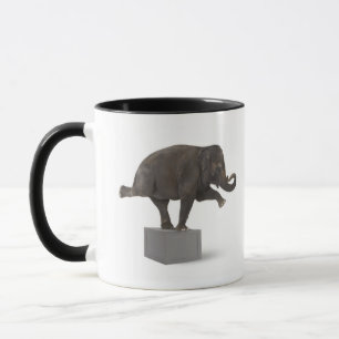 Elephant performing trick on box mug